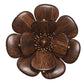 The Begonia Napkin Ring by Kim Seybert features a wooden flower with eight rounded petals, a textured center, and golden accents, adding natural beauty to any table setting.