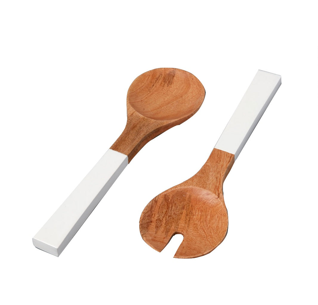 The Be Home Madras Serving Set features two handcrafted mango wood salad servers—one solid, one slotted—with white rectangular handles. Sustainably sourced and shown on a white background.