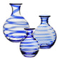 Three clear glass carafes from the William Yeoward Crystal Bella Blue Carafe Collection, featuring blue and white stripes, are arranged on a white background. Proposition 65 warning: may expose you to chemicals known in California.