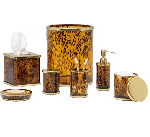 The Benton Tortoise Bath Collection by Pigeon & Poodle features tortoiseshell-patterned accessories, including a tissue box cover, waste bin, toothbrush holder, soap dispenser, tumbler, dish, and lidded container for an elegant bath.