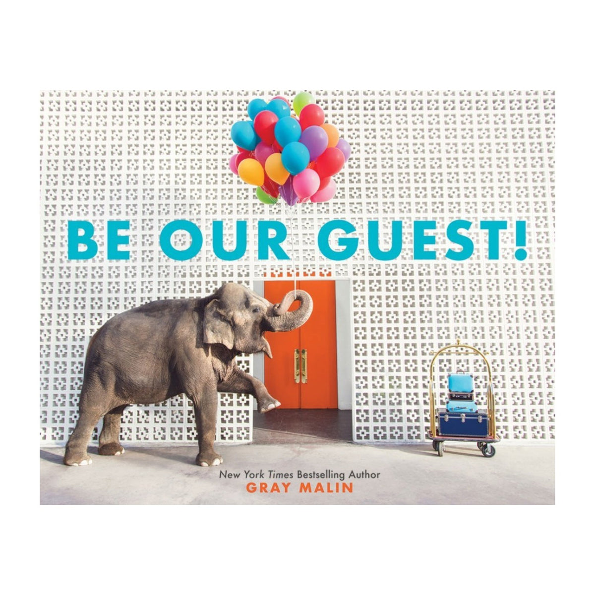 An elephant carries colorful balloons in its trunk toward an orange door at the Parker Palm Springs, passing a luggage cart and the Be Our Guest! sign on a white patterned wall.