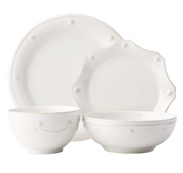 A set of white ceramic dinnerware from the Juliska Berry & Thread Classic Whitewash Collection including two dinner plates and two bowls, featuring a decorative embossed dot pattern around the edges.