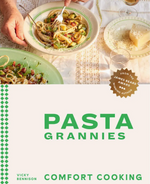 A hand twirls pasta on a fork above a plate set on a table; below, the book cover displays the title “Pasta Grannies: Comfort Cooking” from Chronicle Books, featuring Vicky Bennison’s cherished recipes that celebrate authentic Italian cuisine.