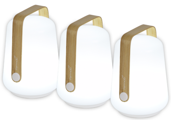Three white and wooden Fermob Bamboo Balad Lamps with a curved handle on a white background.