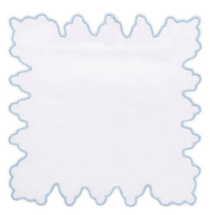 The Sultan Coaster Set by Haute Home features white square linen napkins with irregular, wavy edges trimmed in light blue embroidery—ideal as elegant home décor or sturdy drink coasters. Shown on a white background.