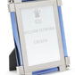 The Light Blue Classic Frame Collection by William Yeoward Crystal features a rectangular photo frame with blue glass accents, nickel-plated silver corners, and a placeholder card labeled with the brand name.