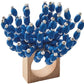 The Kim Seybert Reed Napkin Ring showcases blue and white wooden beads arranged to mimic a coral cluster, making it an ideal accent for coastal-inspired decor.