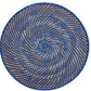 The Calypso Rattan Placemat Set by Deborah Rhodes features hand-woven round mats in blue and tan with a spiral geometric design—ideal as versatile, stylish placemats for indoor or outdoor use.