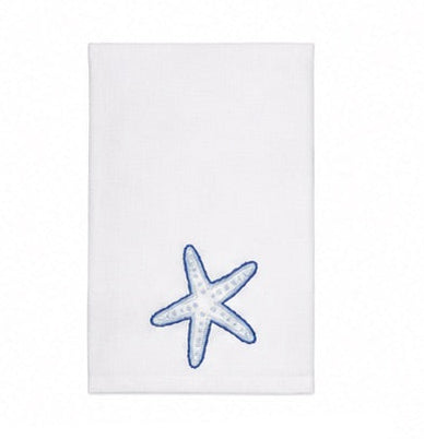 Elevate your home décor with the Haute Home Playful Starfish Bath Collection—a white towel crafted from premium linen, adorned with a blue-outlined starfish motif in the lower right corner and displayed against a plain background for an elegant touch.