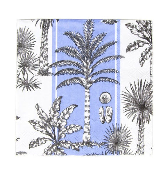 A Caspari Southern Palms Blue/White Cocktail Napkin with a tropical design featuring illustrations of palm trees and tropical plants on a white and blue background.