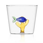 From the Marine Garden Drinkware Collection by Ichendorf Milano, this clear glass tumbler features a decorative blue handmade glass fish and yellow coral at its base.