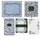 The Blue Hydrangea Desk Accessory Collection by Riffle Paper Co. features a hydrangea notepad, letter writing set with envelopes and pencil, journal, and memo pad—all adorned with elegant white and green floral designs.