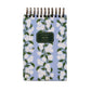 A small spiral-bound notebook with a blue cover featuring white flowers and green leaves, ideal for pairing with the Blue Hydrangea Desk Accessory Collection by Riffle Paper Co. The label reads "Riffle Paper Co. Notes, Ruled Pages.
