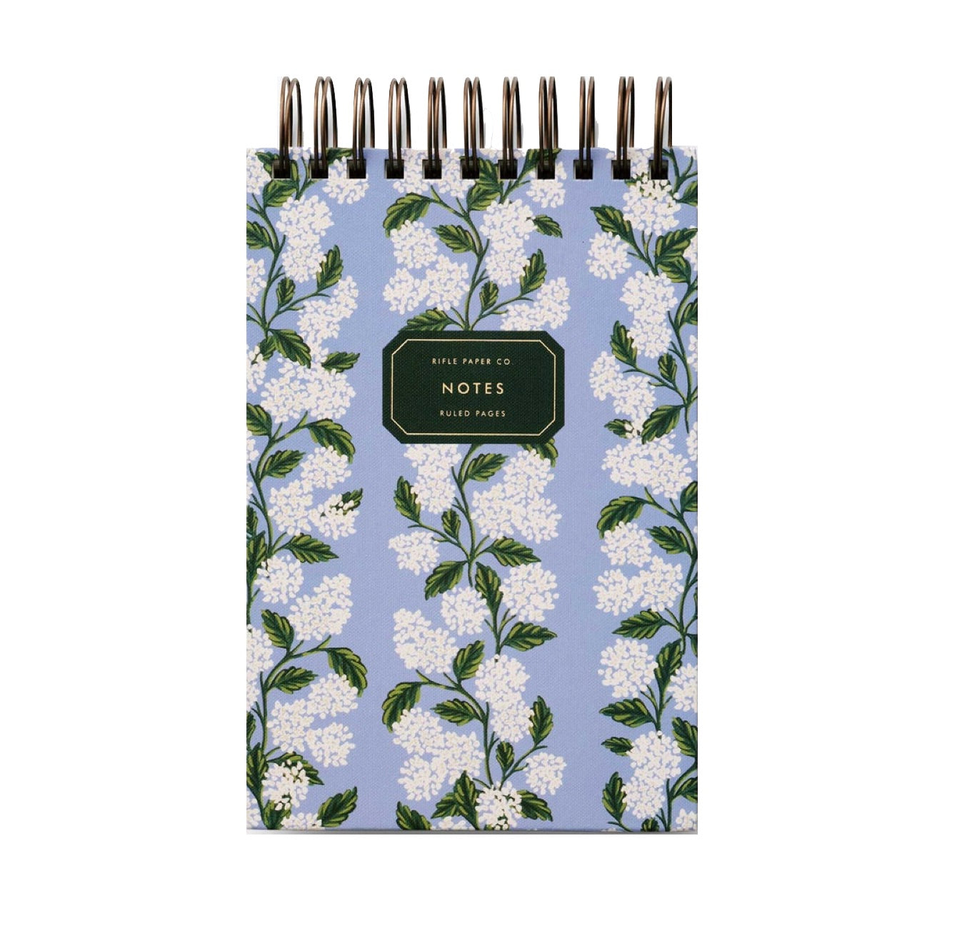 A small spiral-bound notebook with a blue cover featuring white flowers and green leaves, ideal for pairing with the Blue Hydrangea Desk Accessory Collection by Riffle Paper Co. The label reads "Riffle Paper Co. Notes, Ruled Pages.