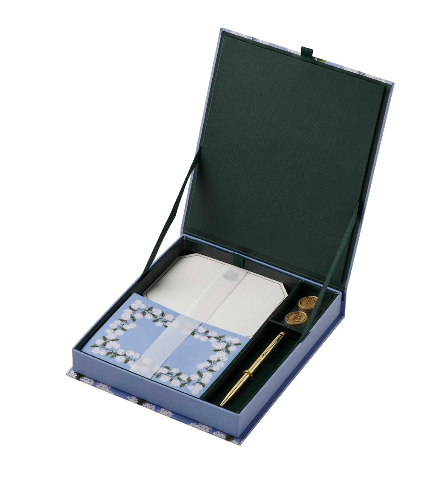 The Blue Hydrangea Desk Accessory Collection by Rifle Paper Co. features a stationery set with floral notecards, envelopes, a gold pen, and two wax seals in a green and blue case—perfect for organizing your desk in style.