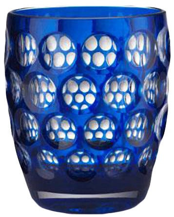 The Mario Luca Giusti Lente Acrylic Dinnerware Collection features a blue tumbler with raised circular indents—ideal for outdoor entertaining.
