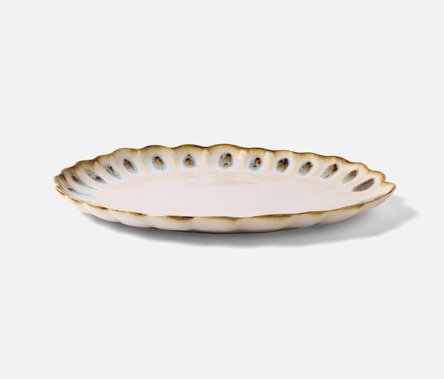 The Amoria Dinnerware Collection by Blue Pheasant features a ceramic oval plate with a scalloped edge, white glaze, and brown-accented rim for vintage-inspired elegance; pictured on a plain white background.