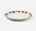 The Amoria Dinnerware Collection by Blue Pheasant features a ceramic plate with a scalloped edge and brown and blue speckled rim, offering vintage-inspired elegance, shown on a plain white background.