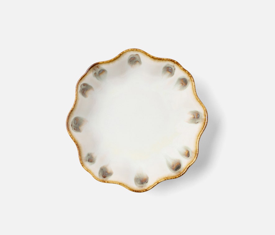Scalloped ceramic plate from Blue Pheasant’s Amoria Dinnerware Collection features a glossy white finish and subtle brown-rimmed accents, offering vintage-inspired elegance to your table.