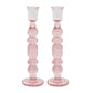 The Provence Candlestick Set by Juliska features two pink mouth-blown glass candlesticks with a stacked, bubble-like design—ideal for adding chic charm to your decor.