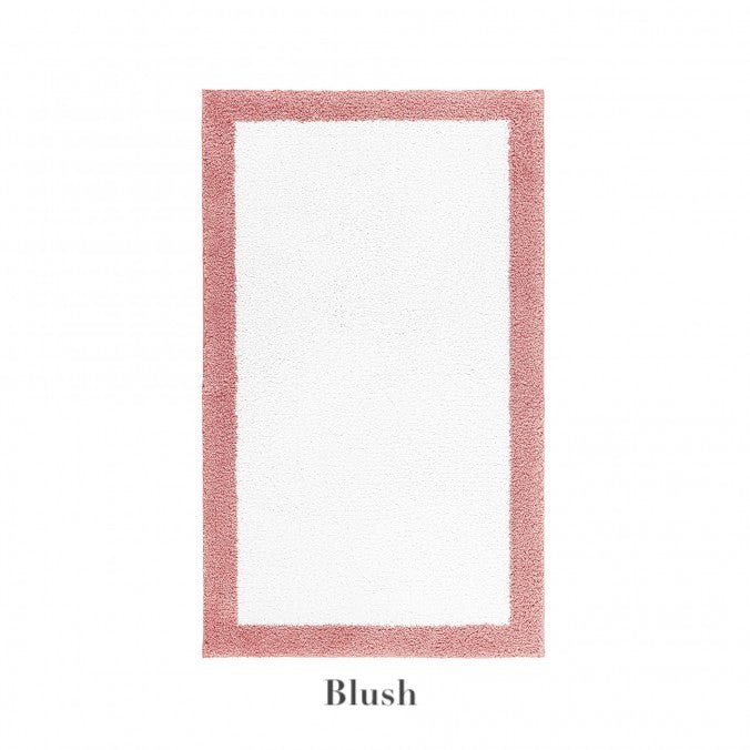 The Graccioza Egoist Border Bath Rug is rectangular and white with a customizable blush pink border, shown on a white background. "Blush" appears below the rug.