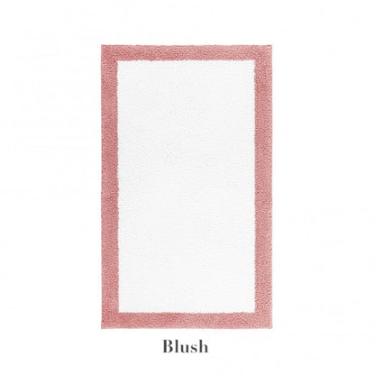 The Graccioza Egoist Border Bath Rug features a thick blush pink customizable border and white center, crafted from soft Egyptian cotton. Displayed on a white background with “Blush” written below the rug.
