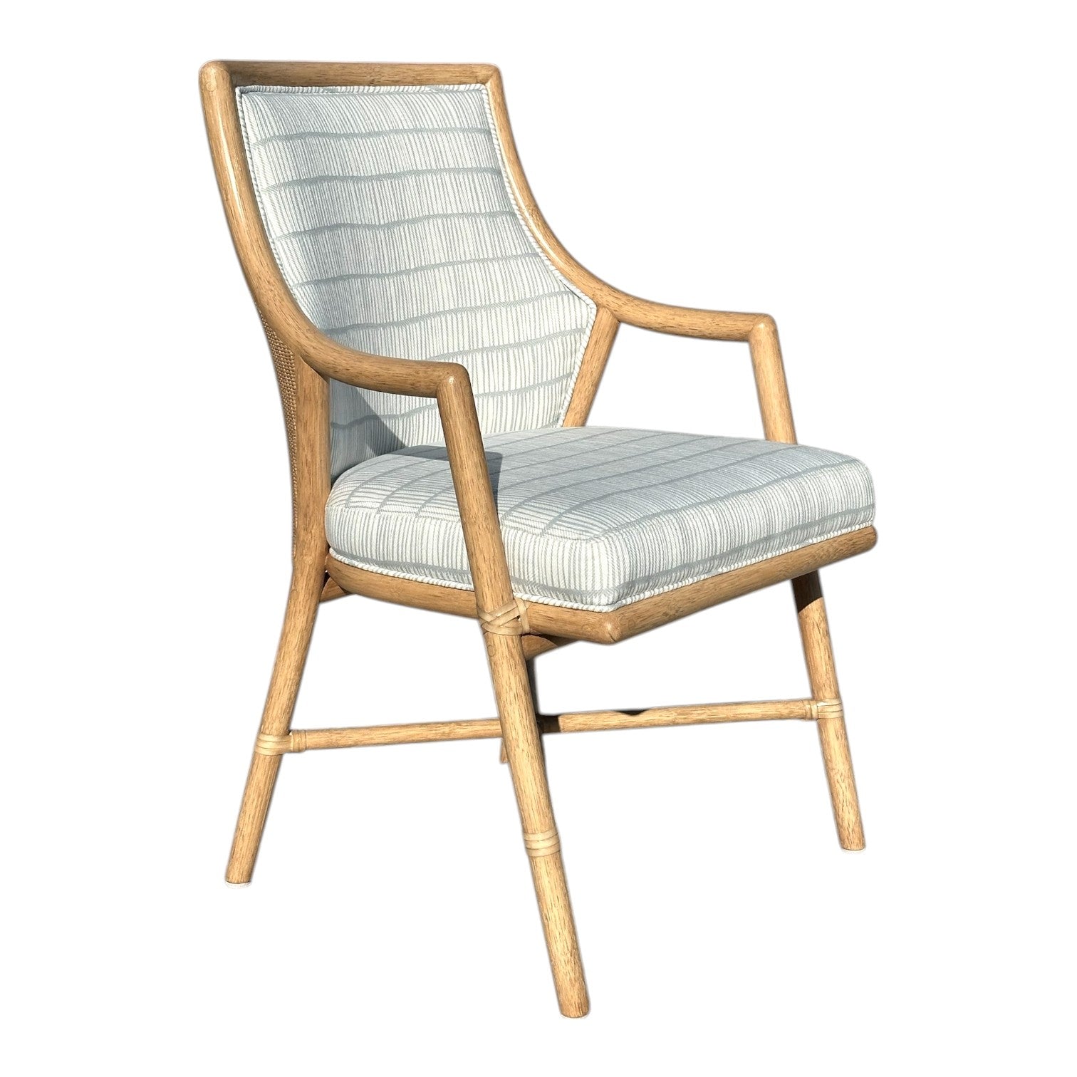 The McGuire Passage Arm Chair features a light wood frame with striped cushioned seat and backrest, blending quality craftsmanship and sophistication—perfect for modern dining spaces.