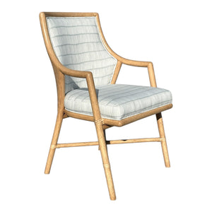 The McGuire Passage Arm Chair features a light wood frame with striped cushioned seat and backrest, blending quality craftsmanship and sophistication—perfect for modern dining spaces.
