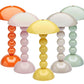 Five Addison Ross Bobbin LED Cordless Lamps, featuring rounded tops and bubble-like stems in pastel and bright colors, provide portable lighting with adjustable levels. All are arranged together against a white background.