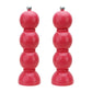 The Hive Bobbin Salt & Pepper Grinder Set features glossy red lacquered mills with ceramic grinders and silver knobs, shown side by side against a white background.