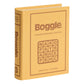 A yellow fabric-wrapped box resembling a book, labeled "Vintage Bookshelf Board Games" by WS Game Company, features a Boggle letter grid on the cover and evokes a classic board game from their Vintage Bookshelf Collection.