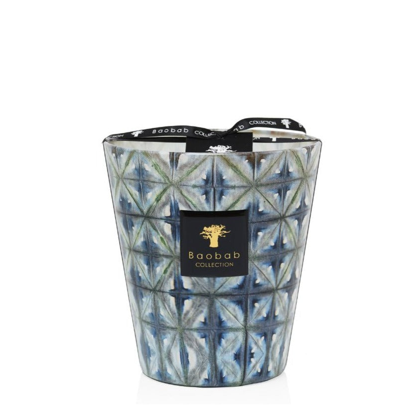 A scented Baobab Bohomania Kilan candle in a textured blue and white glass container with a black label and lid on a white background.