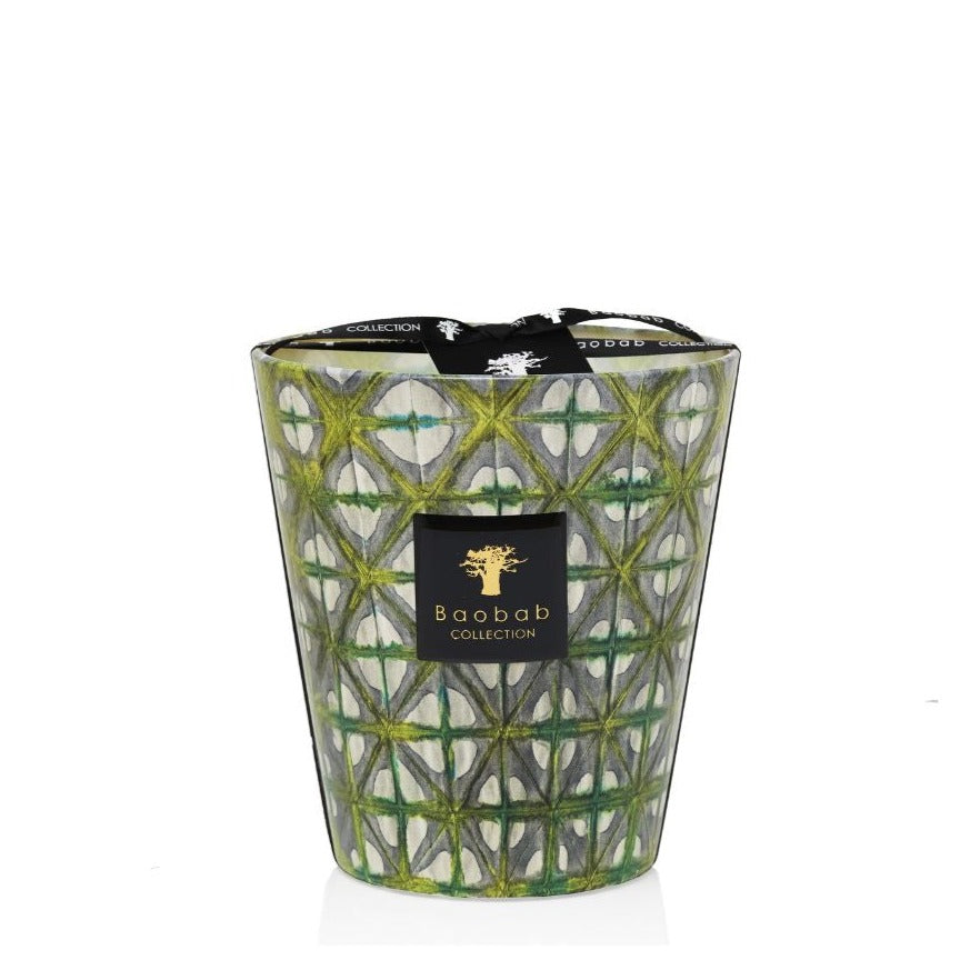 A green and gold Baobab Collection Bohomania Lazlo scented candle in a decorative glass container with a geometric pattern.