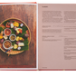 Open Phaidon The Indonesian Table cookbook with a recipe for samoosas alongside an image of various ingredients and prepared samoosas on a leaf platter.