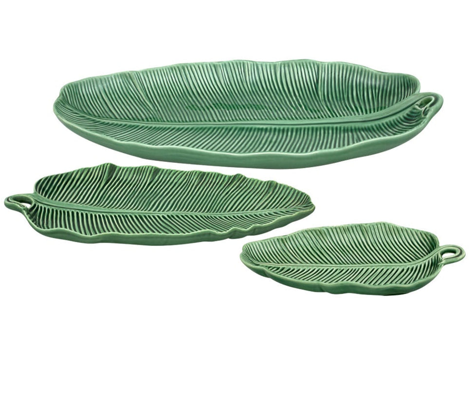 Three green ceramic platters from the HIVE Banana Leaves Platter Collection, handmade in banana leaf shapes with vein details and handles, are displayed on a white background. Part of our elegant Leaves Collection.