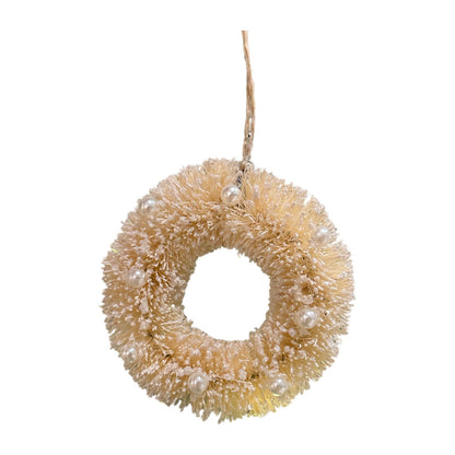 The Dekorasyon Mini Bottlebrush Wreath Ornament is a cream-colored Christmas decor piece with pearl-like beads, hanging from a simple string and displayed against a white background.