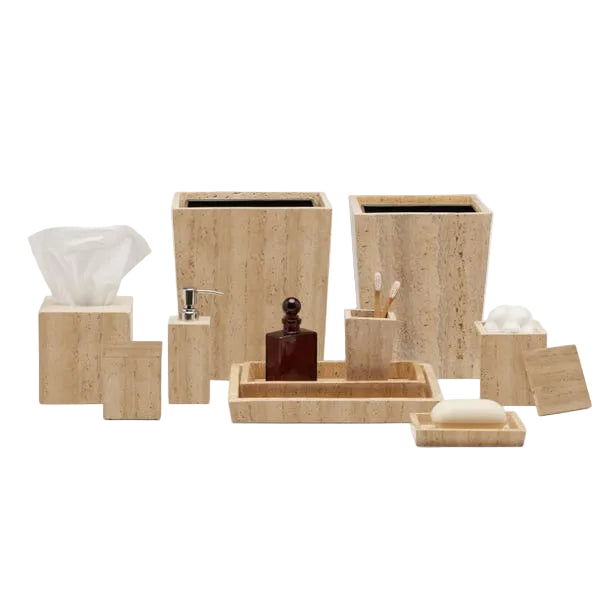 The Bowen Natural Bath Collection by Pigeon & Poodle offers beige stone accessories—tissue box, soap dispenser, trays, waste bins, toothbrush holder, and containers for soap and cotton balls.