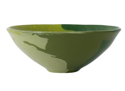 The Geode Bowl Collection by Paul Schneider Ceramics features a green ceramic bowl with a glossy finish and subtle marbled swirls, shown from the side on a white background.