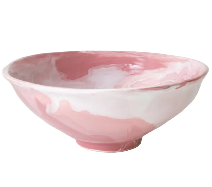 The Geode Bowl Collection by Paul Schneider Ceramics features an elegant pink and white marbled swirl design, adding unique style to any setting.