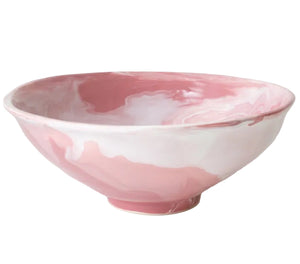 The Geode Bowl Collection by Paul Schneider Ceramics features an elegant pink and white marbled swirl design, adding unique style to any setting.