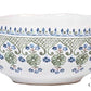 The Juliska Villa Seville Chambray Dinnerware Collection features a white ceramic "Cereal/Ice Cream Bowl" adorned with green and blue floral motifs and a decorative border.