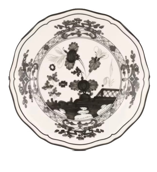 A decorative ceramic plate from the Ginori 1735 Oriente Italiano Albus Dinnerware Collection, featuring a black and white floral design with a central flower and ornamental border, inspired by classic Florentine elegance.