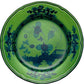 A green ceramic plate from the Ginori 1735 Oriente Italiano Malachite Dinnerware Collection, featuring dark floral and decorative patterns inspired by classic Italian design.