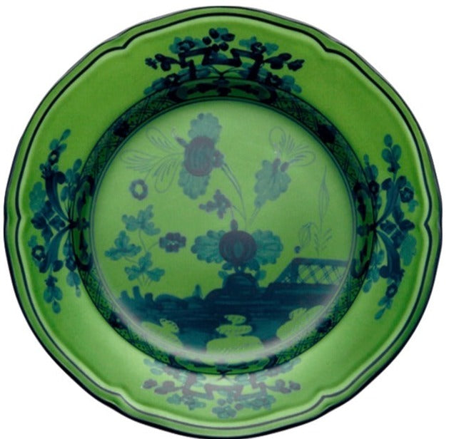 A green ceramic plate from the Ginori 1735 Oriente Italiano Malachite Dinnerware Collection, featuring dark floral and decorative patterns inspired by classic Italian design.