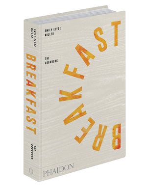 A hardcover cookbook titled "Phaidon Breakfast: The Cookbook" by Emily Elyse Miller, featuring global breakfast recipes and published by Phaidon.