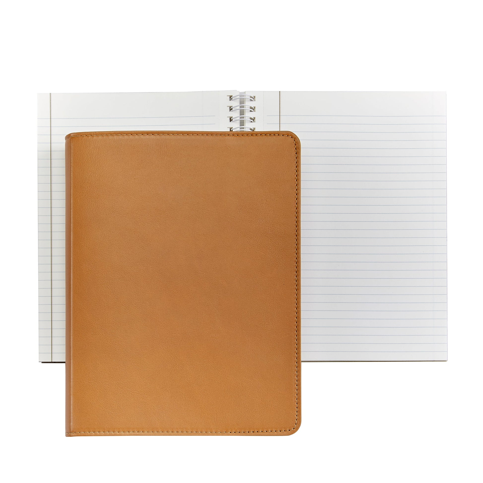 A closed 9" Leather Notebook by Graphic Image sits atop an open spiral-bound notebook with lined premium paper, both placed on a white background.