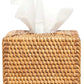 The Dalton Bath Collection by Pigeon & Poodle features a square, handmade rattan tissue box holder with detailed craftsmanship and a white tissue elegantly protruding from the top.