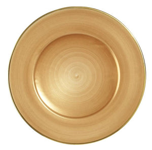 The Anna Weatherley Charger Collection features a round, gold charger plate with a subtle spiral pattern and a thin metallic gold border, shown in an overhead photograph.