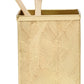 A gold-colored, textured toothbrush holder from Pigeon & Poodle's Mancora Bath Collection features a shiny finish and holds two bamboo toothbrushes with white bristles.