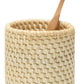 The Dalton Bath Collection by Pigeon & Poodle features a wooden toothbrush elegantly stored in a beige holder, highlighting detailed craftsmanship and carefully handmade rattan weaving.